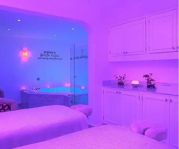 Luxurious couples massage suite with private jacuzzi and ambient lighting at Allure Spa, couples only all inclusive resort in Riviera Maya