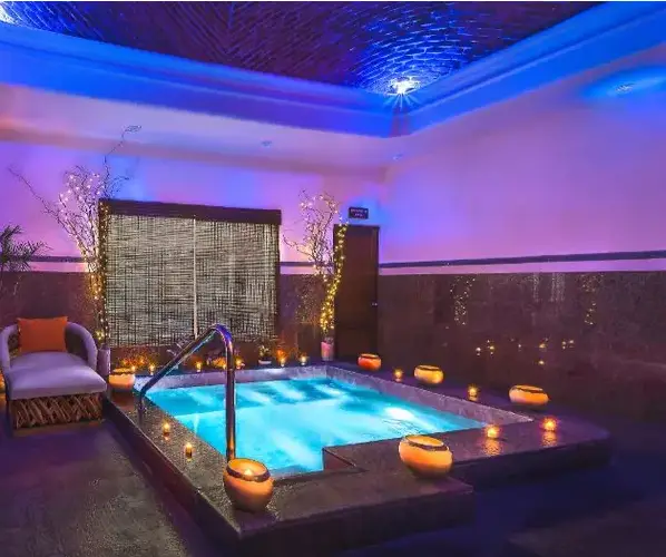 Romantic hydrotherapy pool at Allure Spa, featuring candlelight and intimate ambiance, couples only all inclusive resort in Riviera Maya
