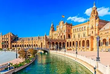 Coastal panorama of Cadiz Spain with whitewashed buildings and blue bay on Desire Lisbon Morocco 2027 itinerary