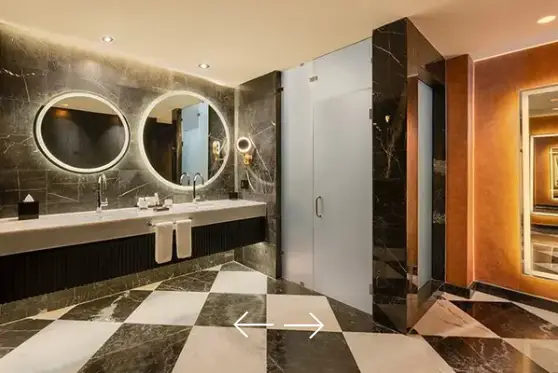 Elegant marble bathroom in the Desire Suite at Desire Riviera Maya with double vanity and luxury finishes, couples only all inclusive resort in the Riviera Maya