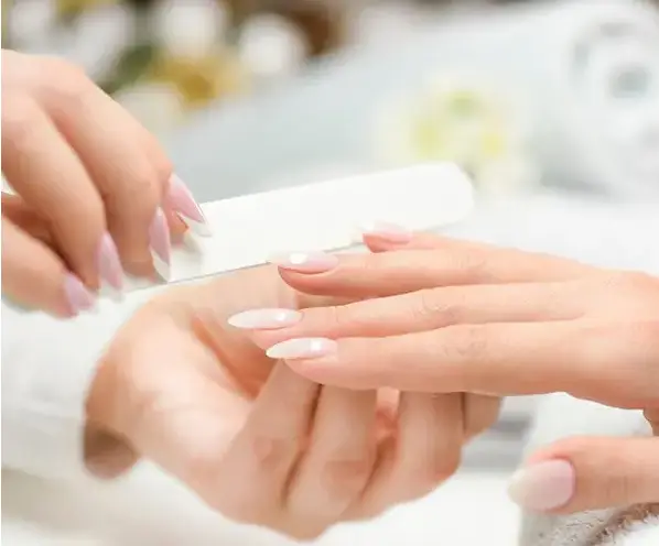 Professional manicure and nail care service at Desire Riviera Maya Allure Spa, couples only all inclusive resort in the Riviera Maya