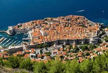 Panoramic view of Dubrovnik Croatia with medieval walls along the sea, featured on Desire Mediterranean Cruise 2026