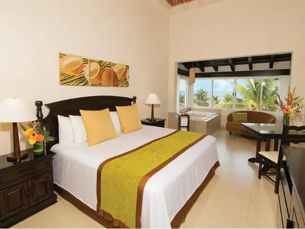 Elegant dome oceanfront suite with a private hot tub, vaulted ceiling, and sea view, part of Hidden Beach Resort’s nude hotel takeover in Riviera Maya.