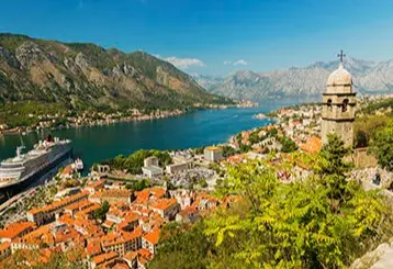 Aerial view of Kotor Montenegro with red-roofed old town and bay, included on Desire Mediterranean Cruise 2026