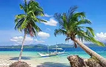 Boracay Island beach destination on the Desire cruise swinger Asia 2028 itinerary with palm trees and turquoise water