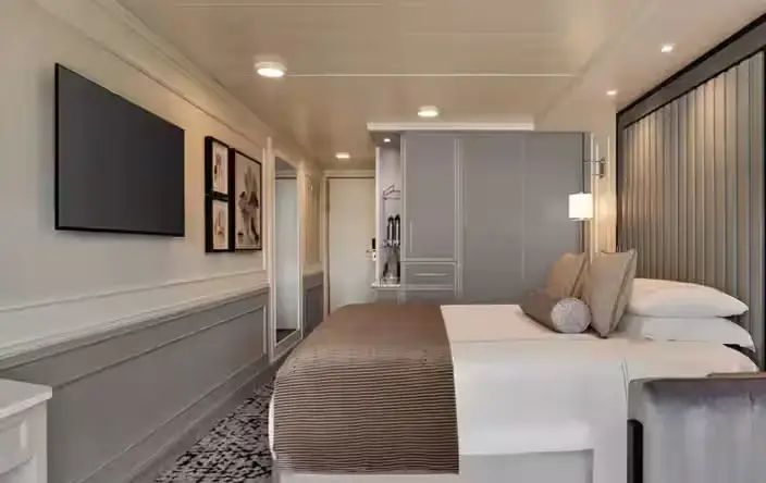 Deluxe Oceanview Stateroom on the Desire cruise swinger Asia 2028 with large window and refined design