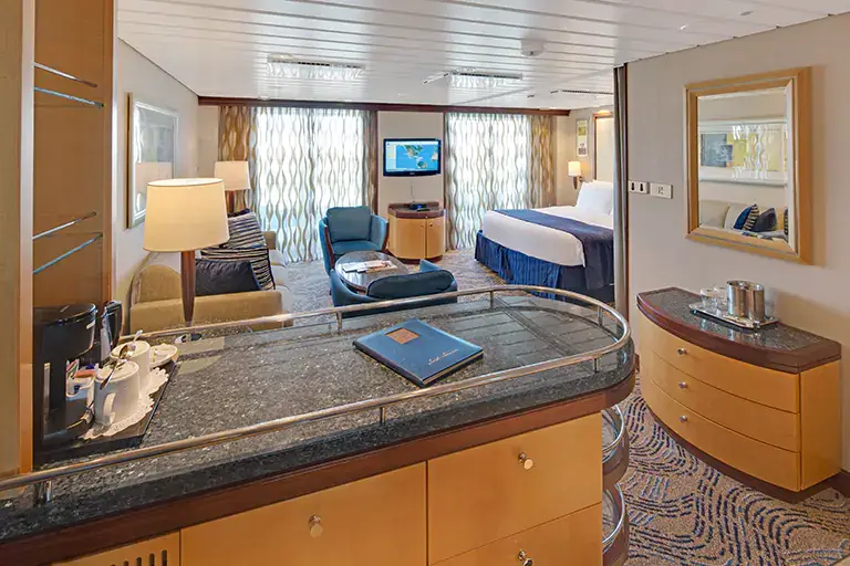 Spacious two bedroom grand suite with seating area and balcony on Mariner of the Seas, Bliss Cruise February 2028 New Orleans nude swinger cruise