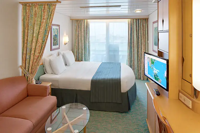 Spacious ocean view stateroom with seating area and large window on Mariner of the Seas, Bliss Cruise February 2028 New Orleans adults only cruise