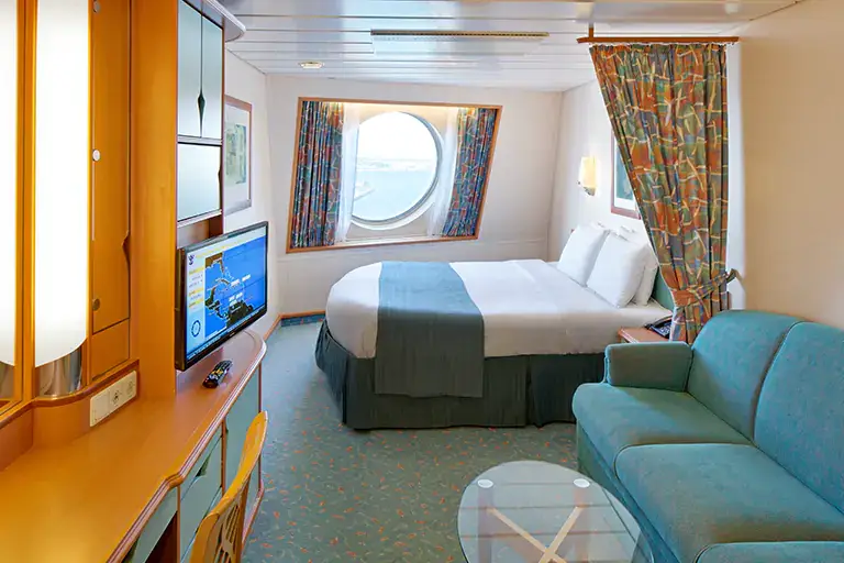 Spacious ocean view stateroom with seating area and large window on Mariner of the Seas, Bliss Cruise February 2028 New Orleans adults only cruise