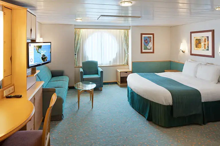Ultra spacious ocean view stateroom with sofa seating and large window on Mariner of the Seas, Bliss Cruise February 2028 New Orleans adults only cruise