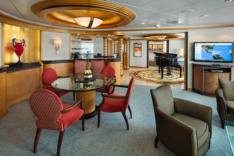 Luxury royal suite dining and living area with piano on Mariner of the Seas, Bliss Cruise February 2028 New Orleans nude swinger cruise