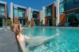 Guest relaxing in private pool at Blue Peach Resort Phuket with nude resort Thailand deals