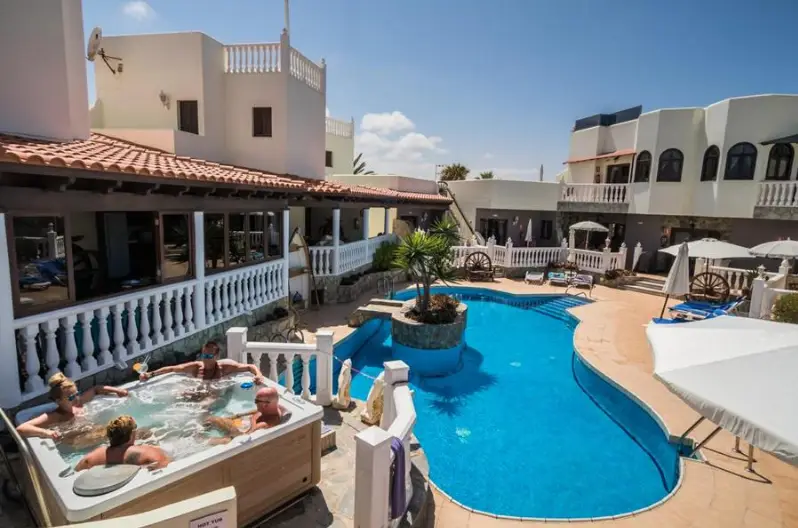 Nude resort Spain Fuerteventura Sun Club featuring a swimming pool, hot tub, sun loungers, and adults only relaxation areas