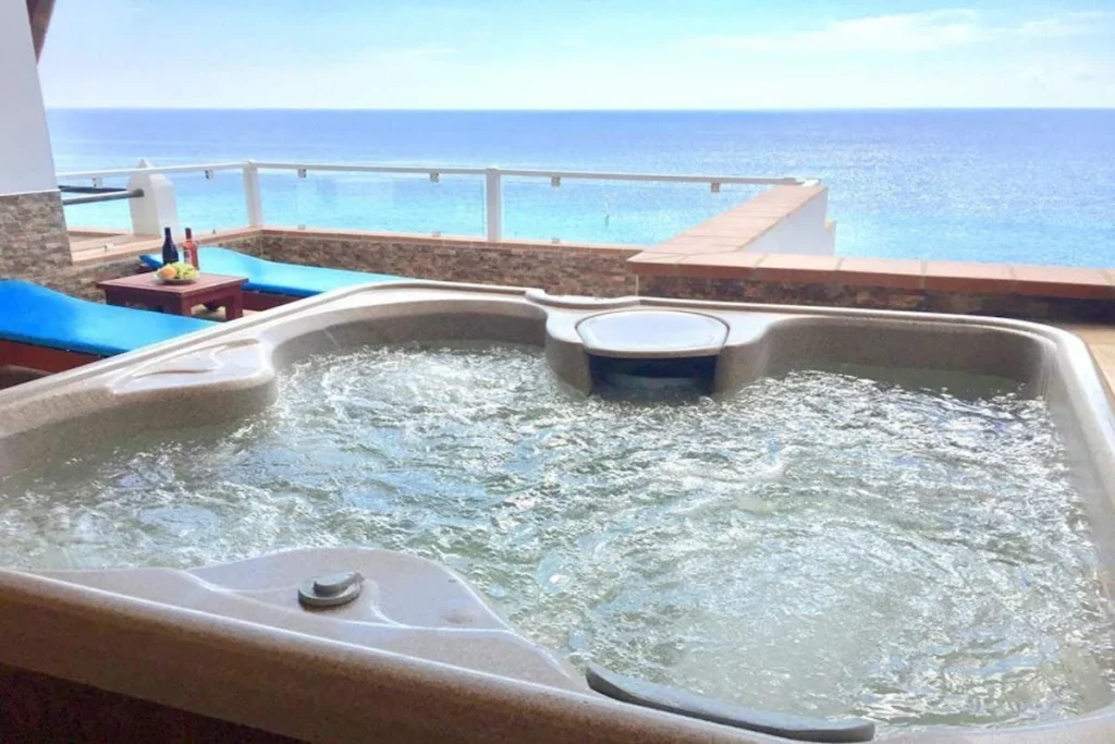 Nude resort Spain Monte Marina private hot tub with panoramic ocean views overlooking the Atlantic coast of Fuerteventura