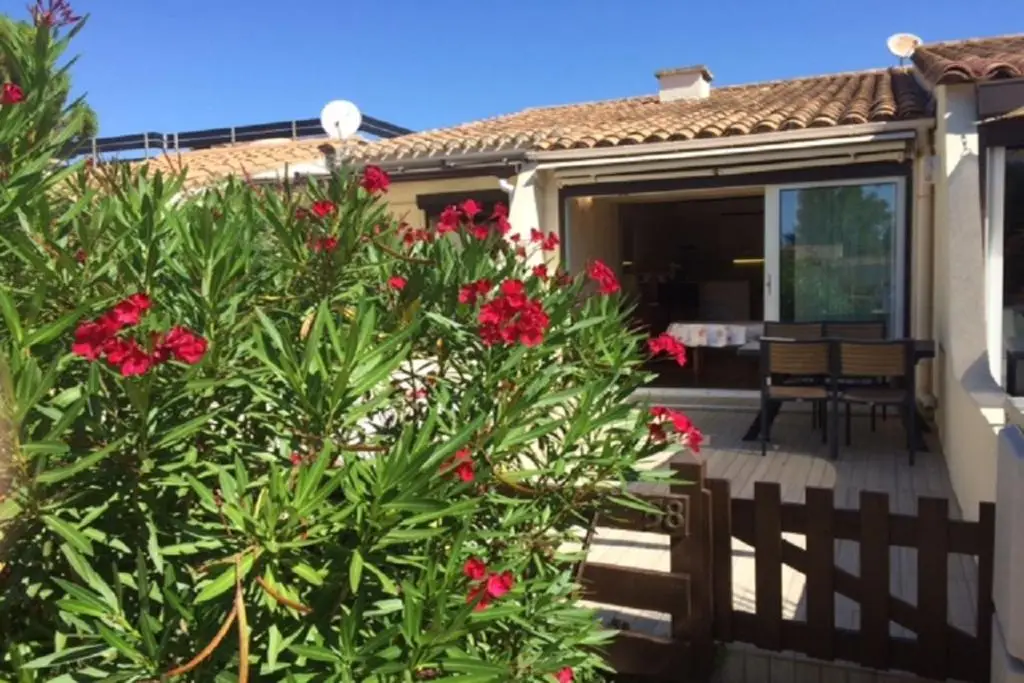 Helio Village villa accommodation with private terrace and garden in Nude City France, located within Cap d'Agde Naturist Village.