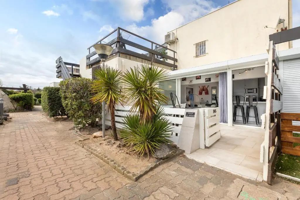 Port Nature Village villa accommodation in Nude City France featuring a private terrace and outdoor living space within Cap d'Agde Naturist Village.