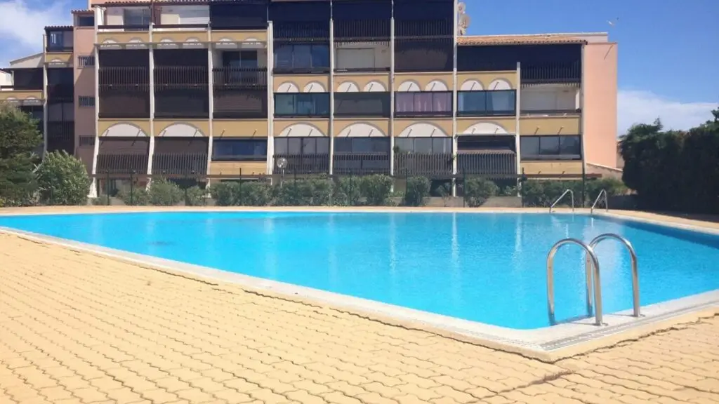 Port Soleil apartments and swimming pool in Cap d'Agde Nude City, France, offering naturist accommodations near the beach, marina, and village amenities.