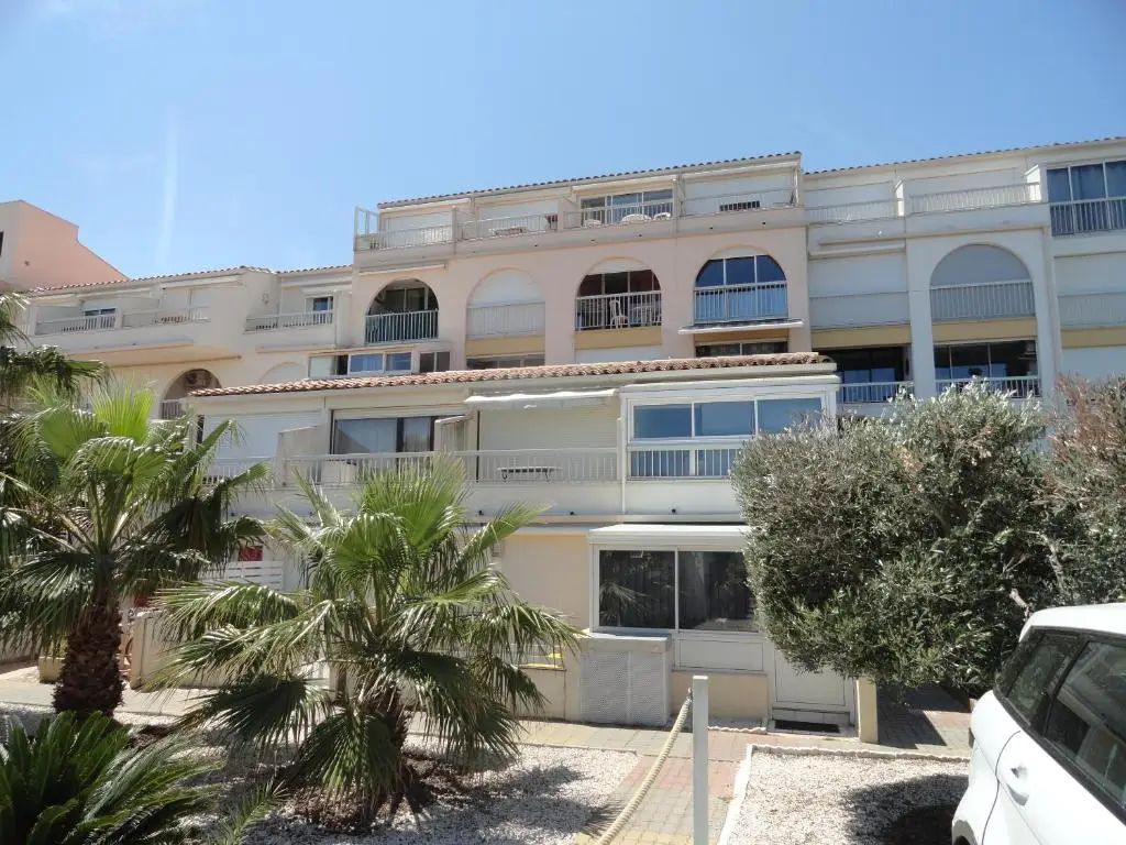 Port Soleil apartments and residents only swimming pool in Nude City France, offering peaceful naturist accommodations within Cap d'Agde's famous clothing optional village.