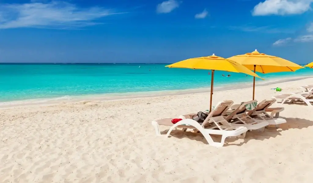 White sand beach in Grand Turk, Turks and Caicos, featured on a Virgin Voyages adults only swinger cruise and lifestyle group vacation with Castaways Travel.