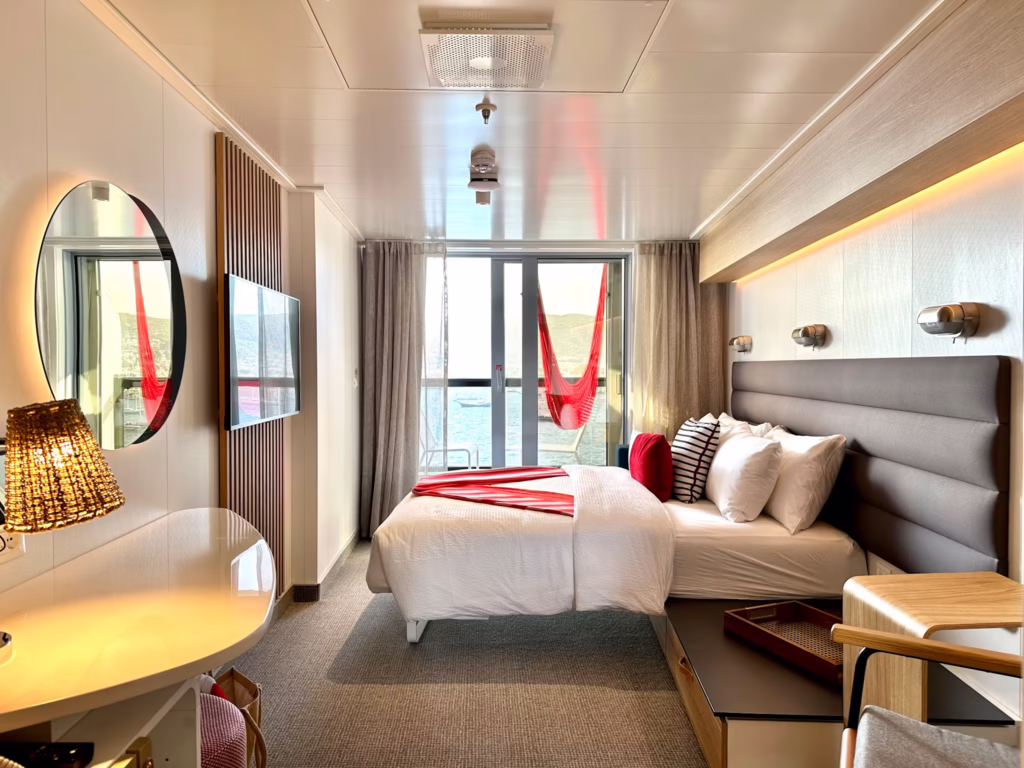 Virgin Voyages Sea Terrace cabin with private balcony and signature red hammock
